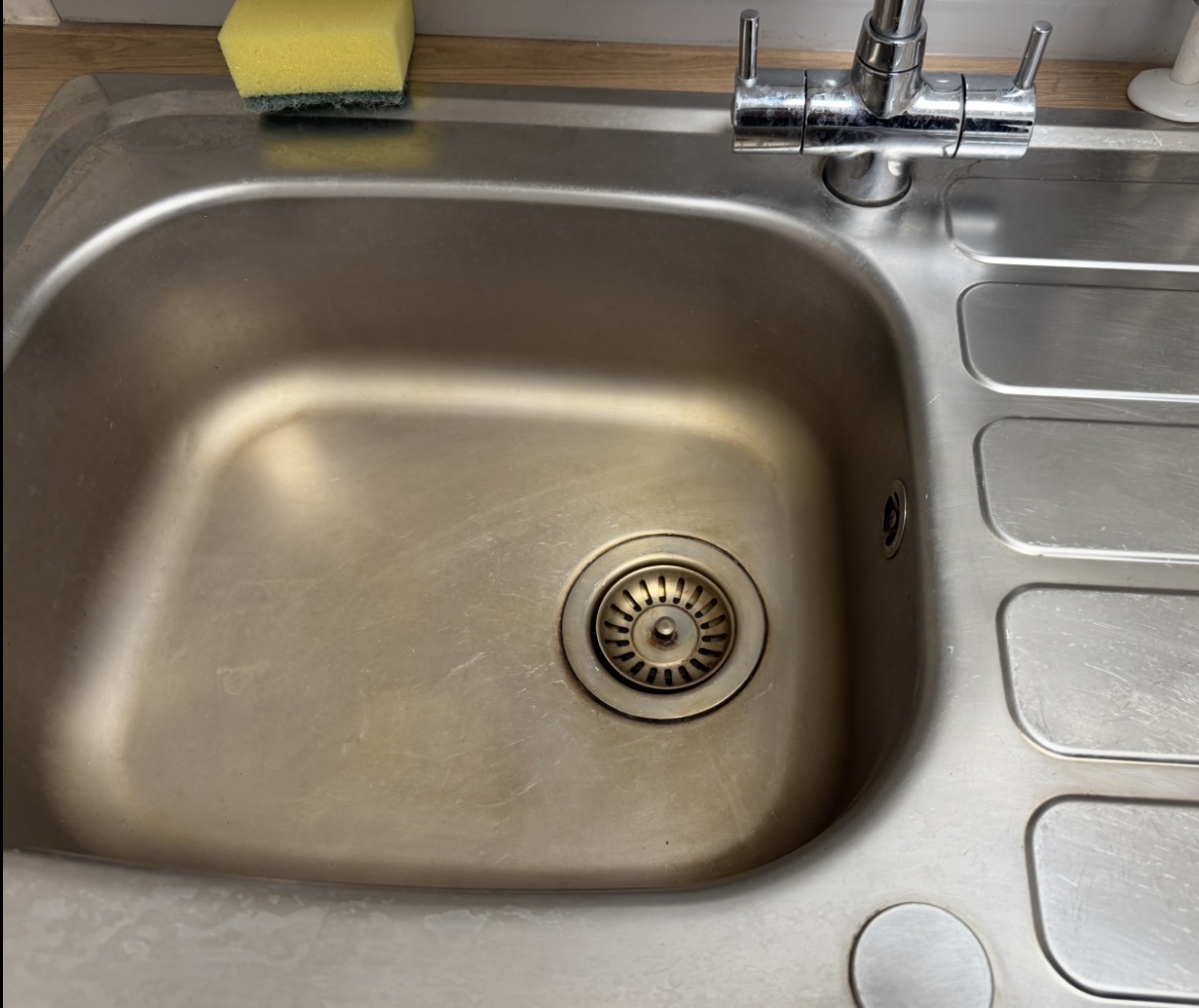 Commercial sink before Bartley's cleaning